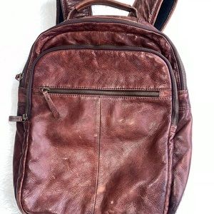 Classic leather backpack; perfect for commuters has a padded laptop compartment.